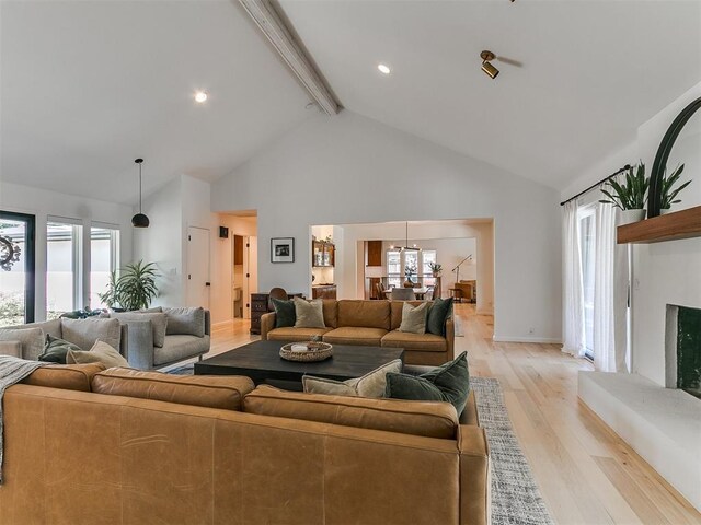 4107 Northhampton Dr, Norman, OK 73072 - living area with beam ceiling, high vaulted ceiling, light wood-style flooring, healthy amount of natural light, and recessed lighting