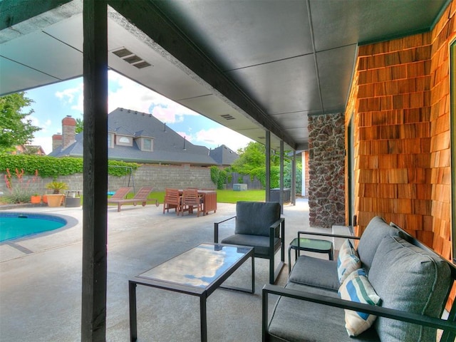4107 Northhampton Dr, Norman, OK 73072 - fenced backyard featuring an outdoor living space and a patio area