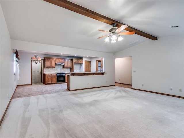 7204 Walnut Creek Dr, Oklahoma City, OK 73142 - unfurnished living room with light carpet, ceiling fan, and a chandelier