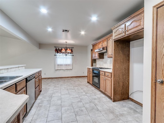 7204 Walnut Creek Dr, Oklahoma City, OK 73142 - kitchen with under cabinet range hood, stainless steel dishwasher, light countertops, a chandelier, and decorative backsplash