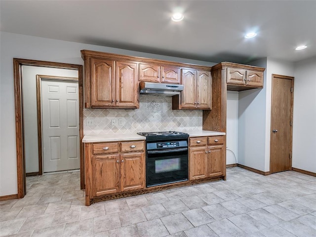7204 Walnut Creek Dr, Oklahoma City, OK 73142 - kitchen featuring under cabinet range hood, black stove, tasteful backsplash, light countertops, and recessed lighting