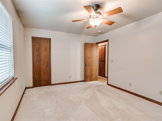 7204 Walnut Creek Dr, Oklahoma City, OK 73142 - unfurnished bedroom with light carpet, multiple windows, and ceiling fan