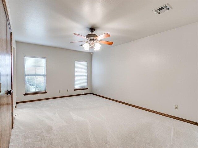 7204 Walnut Creek Dr, Oklahoma City, OK 73142 - spare room featuring light carpet and ceiling fan
