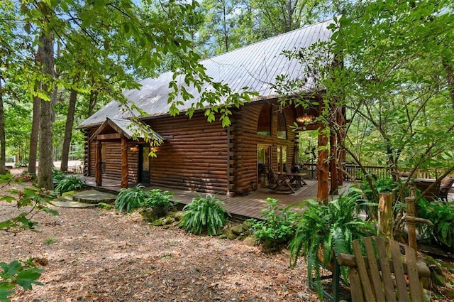185 Marlin Dr, Broken Bow, OK 74728 - view of property exterior featuring log siding, metal roof, and a wooden deck