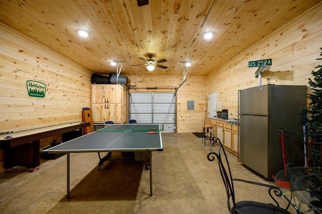 185 Marlin Dr, Broken Bow, OK 74728 - recreation room featuring wooden walls, a ceiling fan, a garage, concrete floors, and recessed lighting