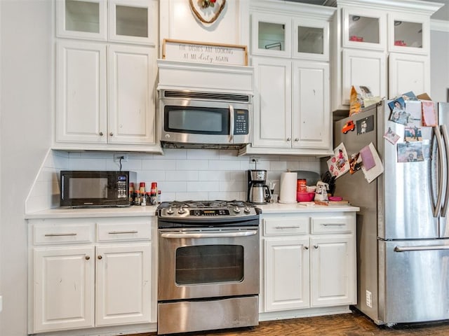 17217 Prado Dr, Oklahoma City, OK 73170 - kitchen with stainless steel appliances, light countertops, and white cabinets