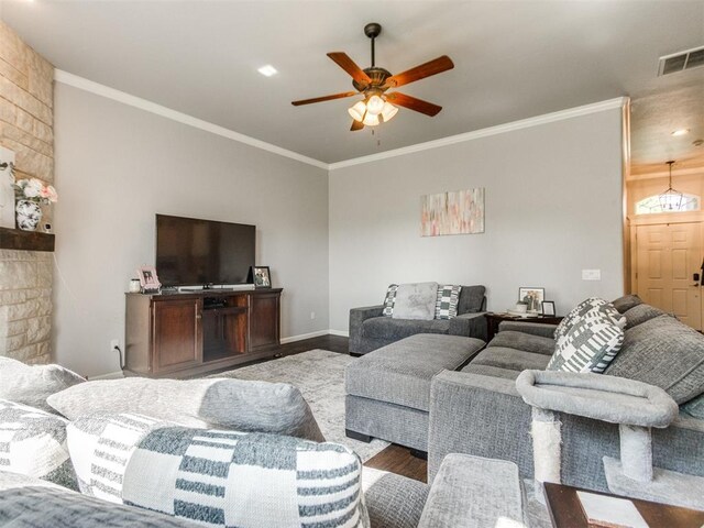 17217 Prado Dr, Oklahoma City, OK 73170 - living area featuring wood finished floors, ceiling fan, crown molding, and baseboards