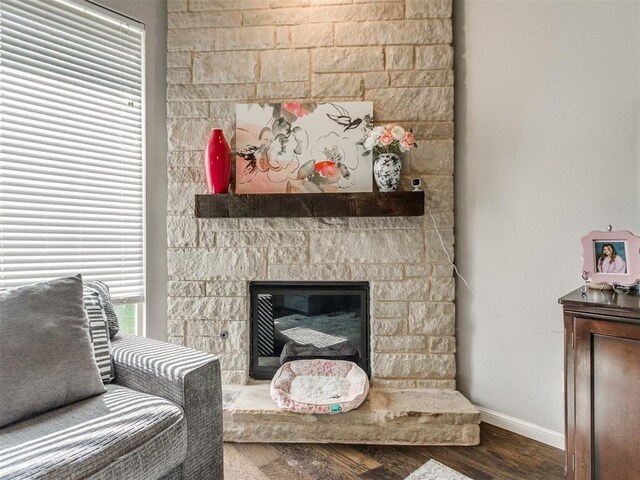 17217 Prado Dr, Oklahoma City, OK 73170 - sitting room featuring baseboards, wood finished floors, and a fireplace