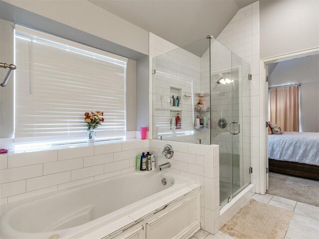 17217 Prado Dr, Oklahoma City, OK 73170 - full bathroom with a bath, connected bathroom, a shower stall, vaulted ceiling, and tile patterned floors