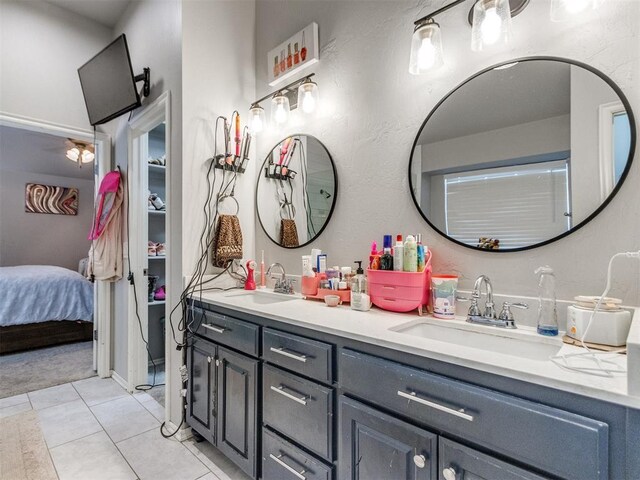 17217 Prado Dr, Oklahoma City, OK 73170 - bathroom with double vanity, connected bathroom, and tile patterned flooring