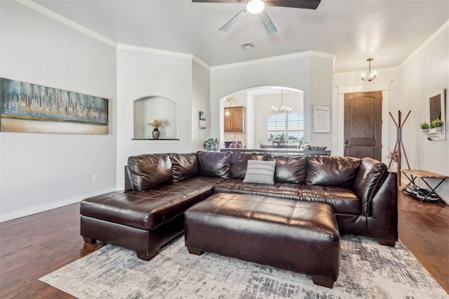 908 Carol Ann Pl, Moore, OK 73160 - living area featuring a chandelier, wood finished floors, crown molding, a ceiling fan, and arched walkways