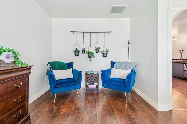 908 Carol Ann Pl, Moore, OK 73160 - living area featuring wood-type flooring and arched walkways