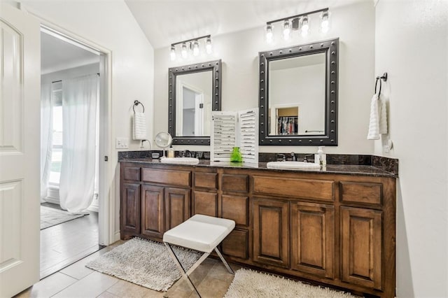 908 Carol Ann Pl, Moore, OK 73160 - full bath with double vanity, lofted ceiling, and tile patterned flooring