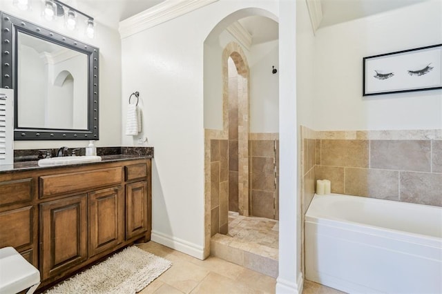 908 Carol Ann Pl, Moore, OK 73160 - full bath with a garden tub, vanity, a tile shower, tile patterned flooring, and ornamental molding