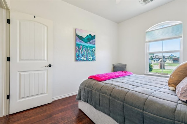 908 Carol Ann Pl, Moore, OK 73160 - bedroom with dark wood-type flooring and baseboards