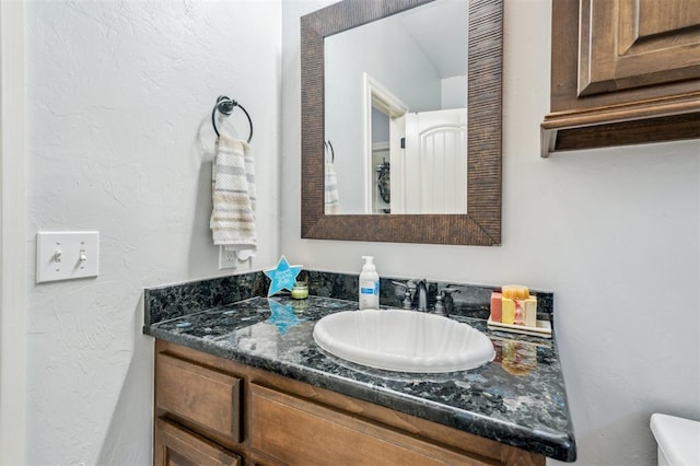 908 Carol Ann Pl, Moore, OK 73160 - half bathroom featuring vanity and toilet