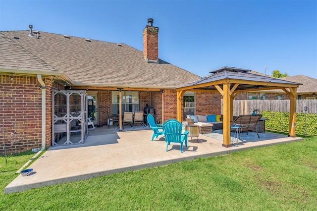 908 Carol Ann Pl, Moore, OK 73160 - rear view of property featuring brick siding, an outdoor hangout area, a chimney, and a shingled roof