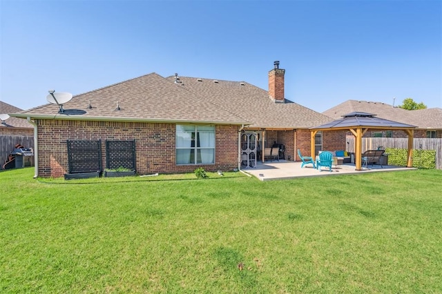 908 Carol Ann Pl, Moore, OK 73160 - rear view of property featuring a gazebo, a patio, a chimney, and brick siding