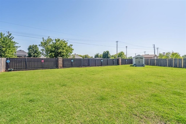 908 Carol Ann Pl, Moore, OK 73160 - fenced backyard featuring a storage unit