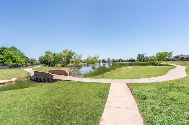 908 Carol Ann Pl, Moore, OK 73160 - view of property's community featuring a water view and a lawn