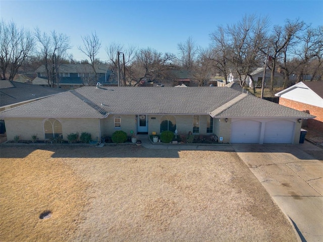 5108 NW 19th Ter, Oklahoma City, OK 73127 - ranch-style house with a garage, driveway, a shingled roof, and a front yard