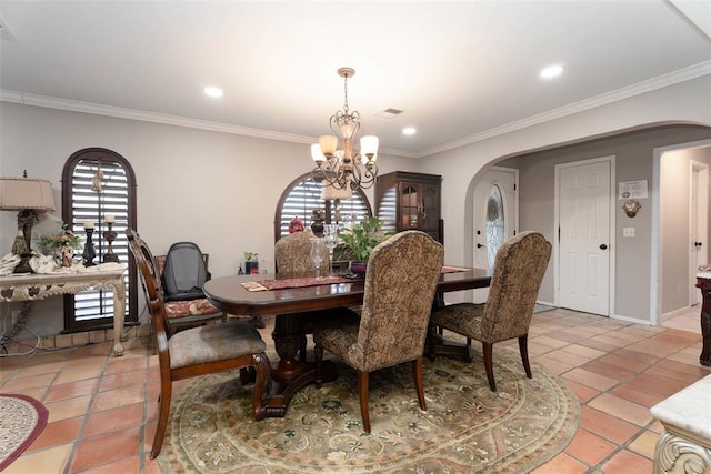 5108 NW 19th Ter, Oklahoma City, OK 73127 - dining room featuring arched walkways, a chandelier, crown molding, recessed lighting, and light tile patterned floors