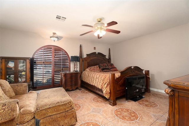 5108 NW 19th Ter, Oklahoma City, OK 73127 - bedroom with light tile patterned floors, ceiling fan, and baseboards