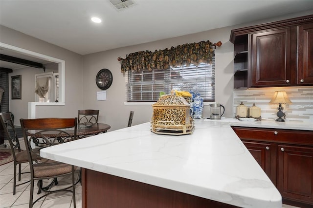 5108 NW 19th Ter, Oklahoma City, OK 73127 - kitchen with a peninsula, open shelves, recessed lighting, light stone countertops, and backsplash