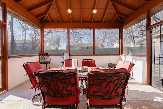 5108 NW 19th Ter, Oklahoma City, OK 73127 - sunroom with carpet floors, plenty of natural light, outdoor dining space, and wood ceiling