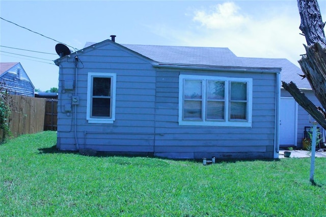 1521 SW 45th St, Oklahoma City, OK 73119 - view of side of home featuring a shingled roof