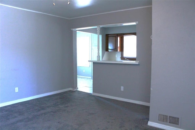 1521 SW 45th St, Oklahoma City, OK 73119 - carpeted spare room featuring crown molding and baseboards