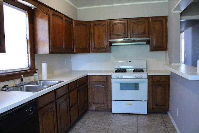 1521 SW 45th St, Oklahoma City, OK 73119 - kitchen with gas range gas stove, under cabinet range hood, black dishwasher, and plenty of natural light