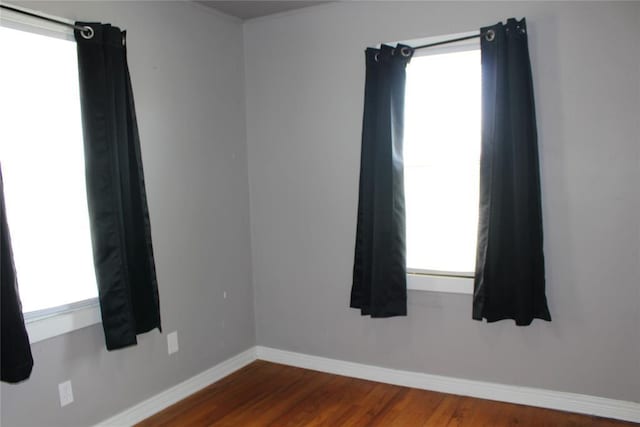 1521 SW 45th St, Oklahoma City, OK 73119 - spare room with dark wood-style flooring and baseboards