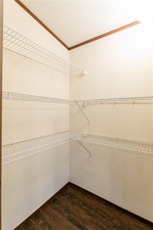 20649 E 1110th Rd, Canute, OK 73626 - walk in closet with dark wood finished floors
