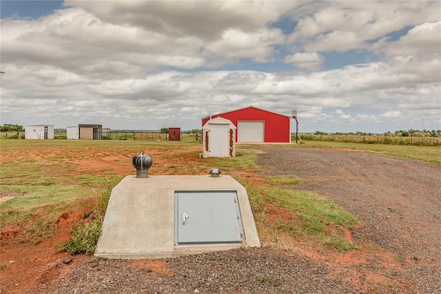 20649 E 1110th Rd, Canute, OK 73626 - view of storm shelter featuring an outbuilding