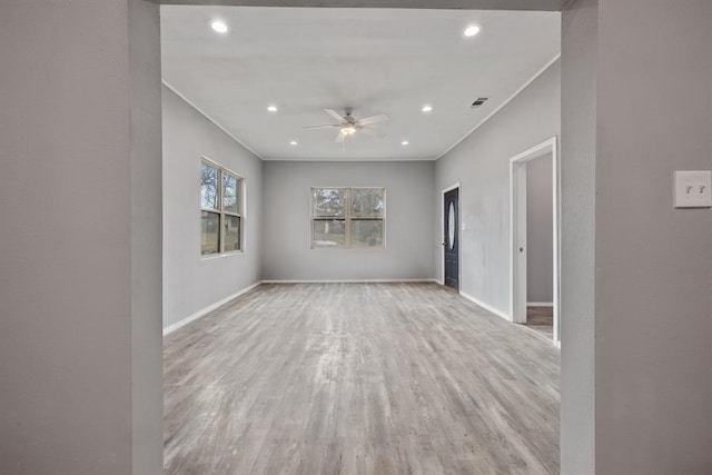 305 E Laurel St, Hugo, OK 74743 - unfurnished room featuring crown molding, light wood finished floors, baseboards, ceiling fan, and recessed lighting