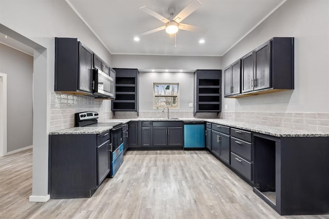 305 E Laurel St, Hugo, OK 74743 - kitchen featuring electric range oven, dishwasher, a sink, stainless steel microwave, and a ceiling fan
