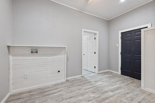 305 E Laurel St, Hugo, OK 74743 - entryway with wood finished floors, baseboards, and crown molding