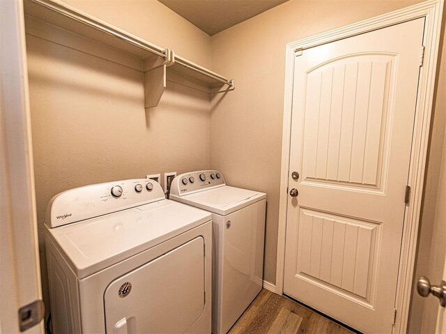 4212 Bonaparte Blvd, Midwest City, OK 73110 - washroom with washer and clothes dryer and wood finished floors