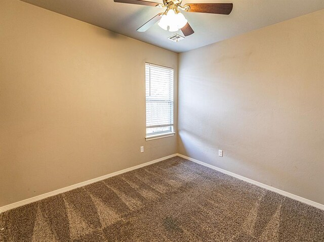 4212 Bonaparte Blvd, Midwest City, OK 73110 - unfurnished room with dark carpet, baseboards, and ceiling fan