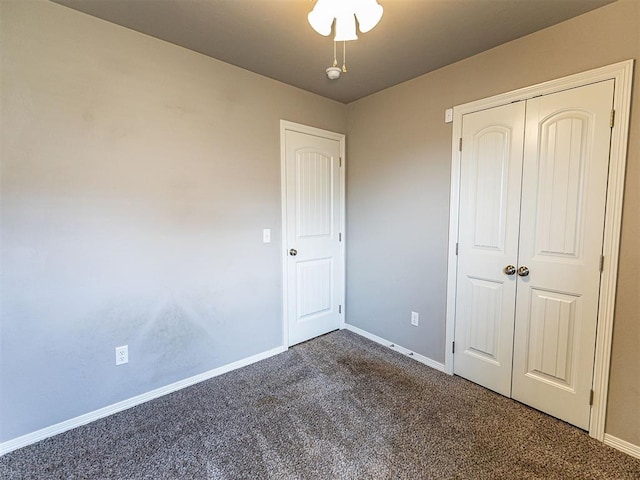 4212 Bonaparte Blvd, Midwest City, OK 73110 - unfurnished bedroom with dark carpet, baseboards, and a closet
