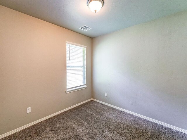 4212 Bonaparte Blvd, Midwest City, OK 73110 - unfurnished room featuring dark carpet and baseboards