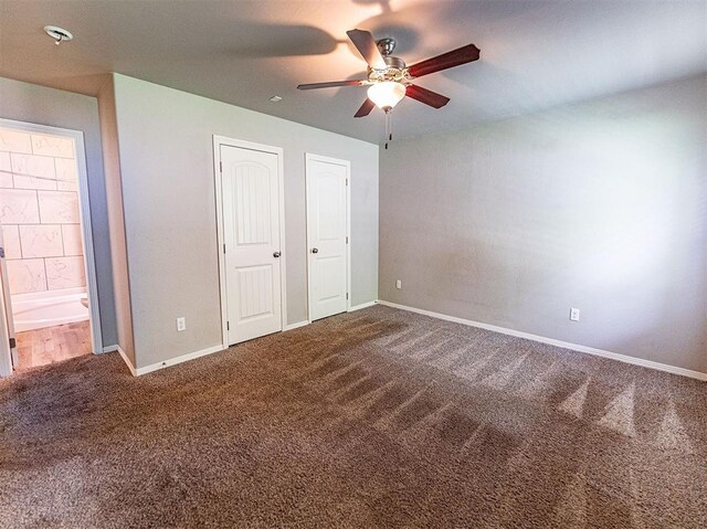 4212 Bonaparte Blvd, Midwest City, OK 73110 - unfurnished bedroom with carpet floors, baseboards, ceiling fan, and connected bathroom