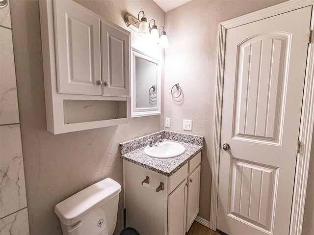 4212 Bonaparte Blvd, Midwest City, OK 73110 - half bath with vanity, toilet, and a textured wall