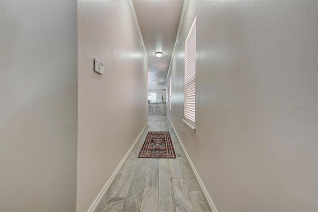 8340 NW 137th St, Oklahoma City, OK 73142 - hallway featuring baseboards and light wood-style floors