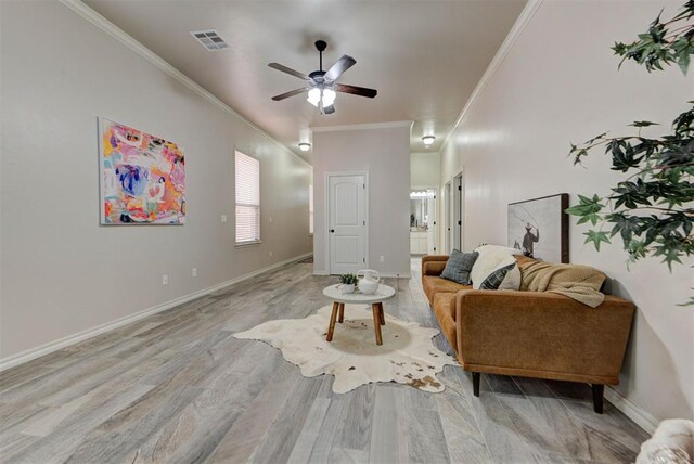 8340 NW 137th St, Oklahoma City, OK 73142 - living area with ornamental molding, a ceiling fan, and wood finished floors