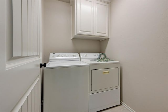 8340 NW 137th St, Oklahoma City, OK 73142 - laundry area with washing machine and clothes dryer and cabinet space