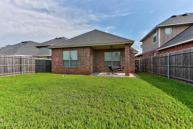 8340 NW 137th St, Oklahoma City, OK 73142 - back of house with brick siding, a patio, a fenced backyard, and a shingled roof