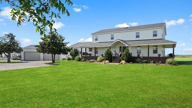 10506 W Smith Rd, El Reno, OK 73036 - view of front of home featuring covered porch, a front lawn, and a detached garage