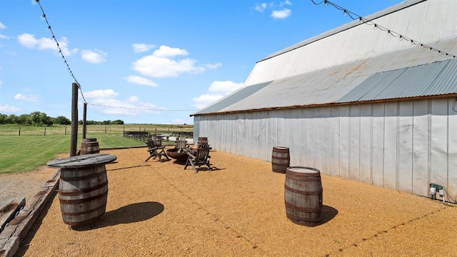 10506 W Smith Rd, El Reno, OK 73036 - view of patio / terrace featuring an outbuilding and a view of rural / pastoral area